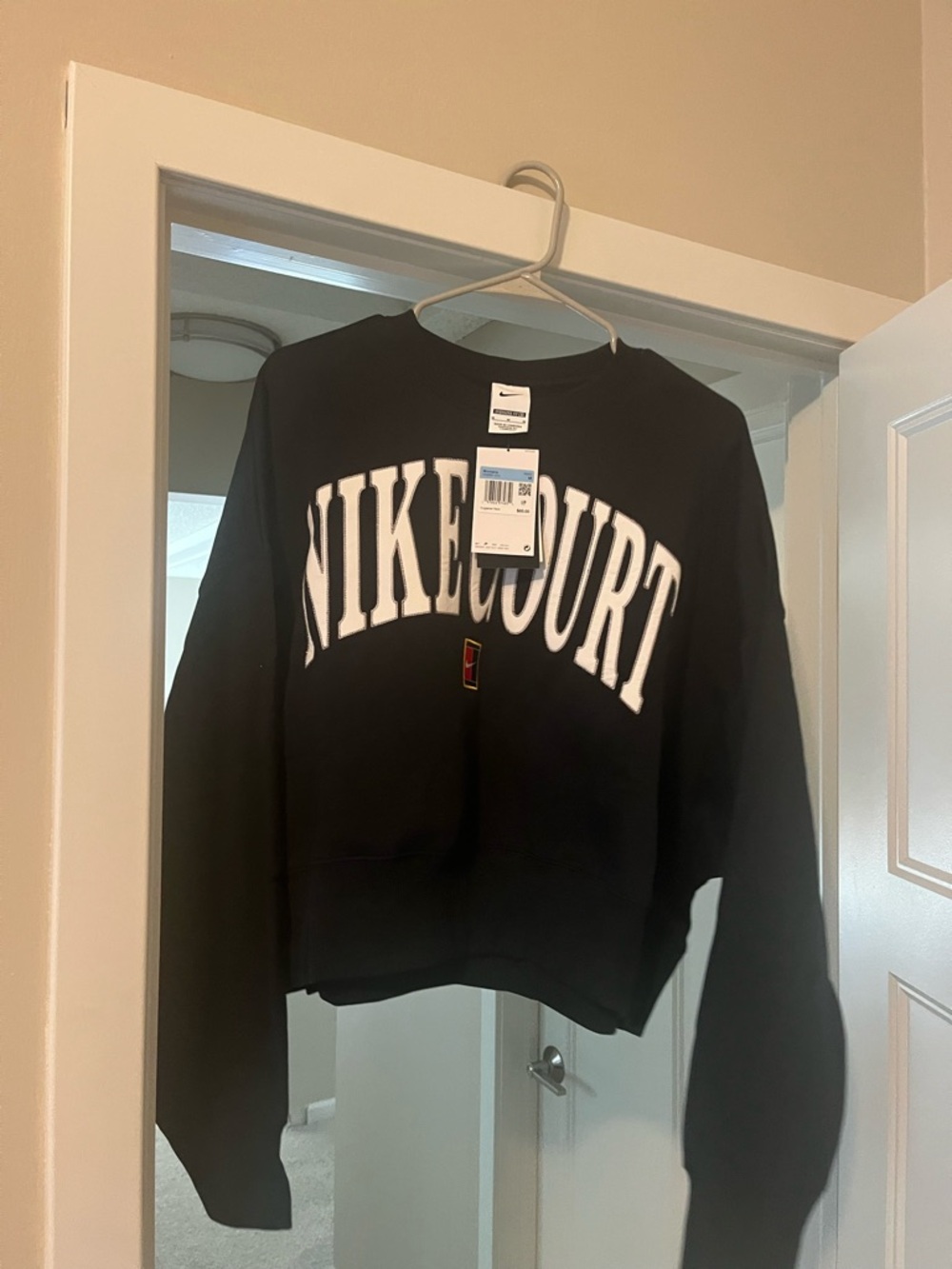 Nike Black Crewneck Sweatshirt with White 'NIKECOURT' Arch Logo